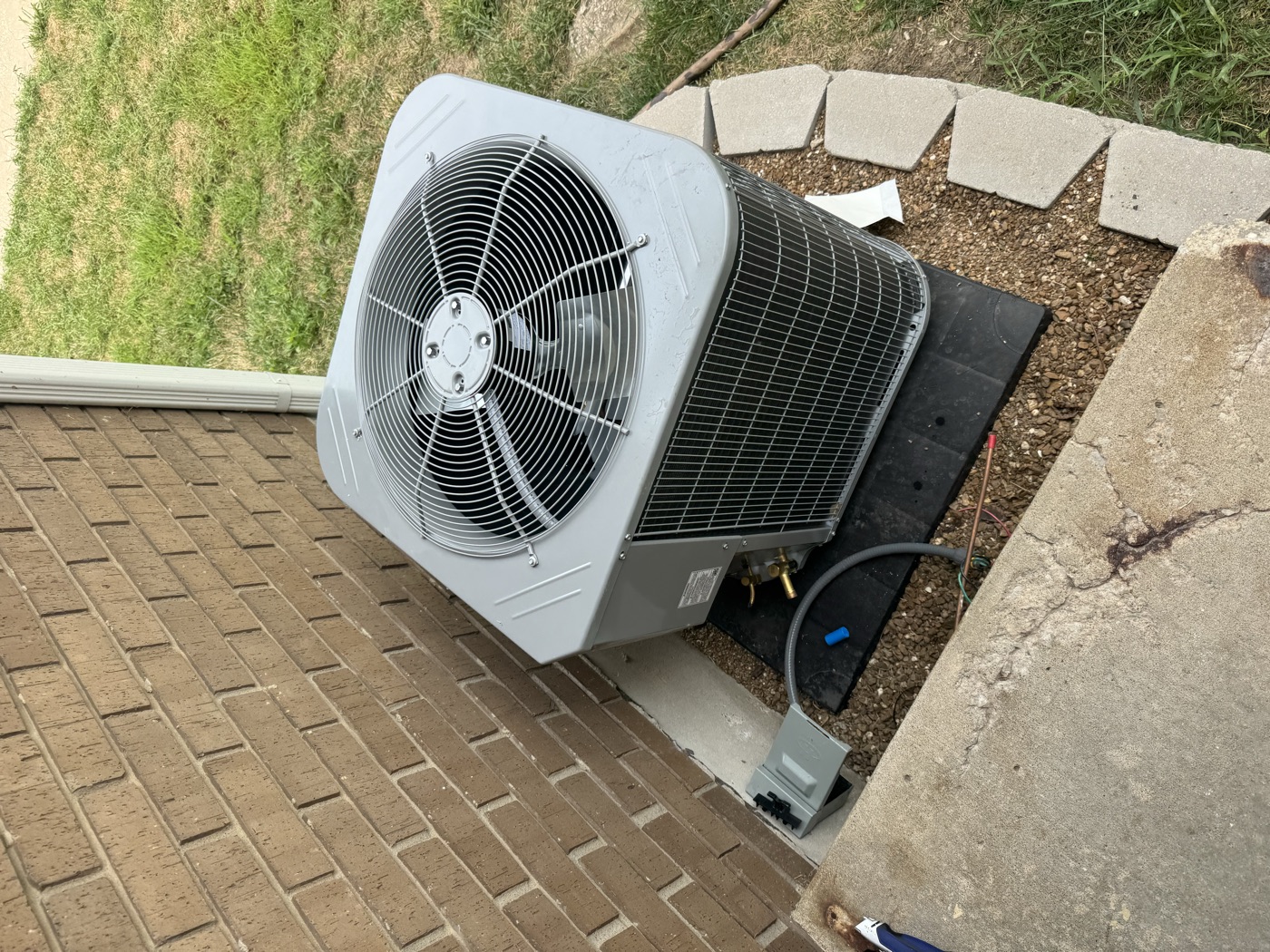 AC unit installed at brick residential home